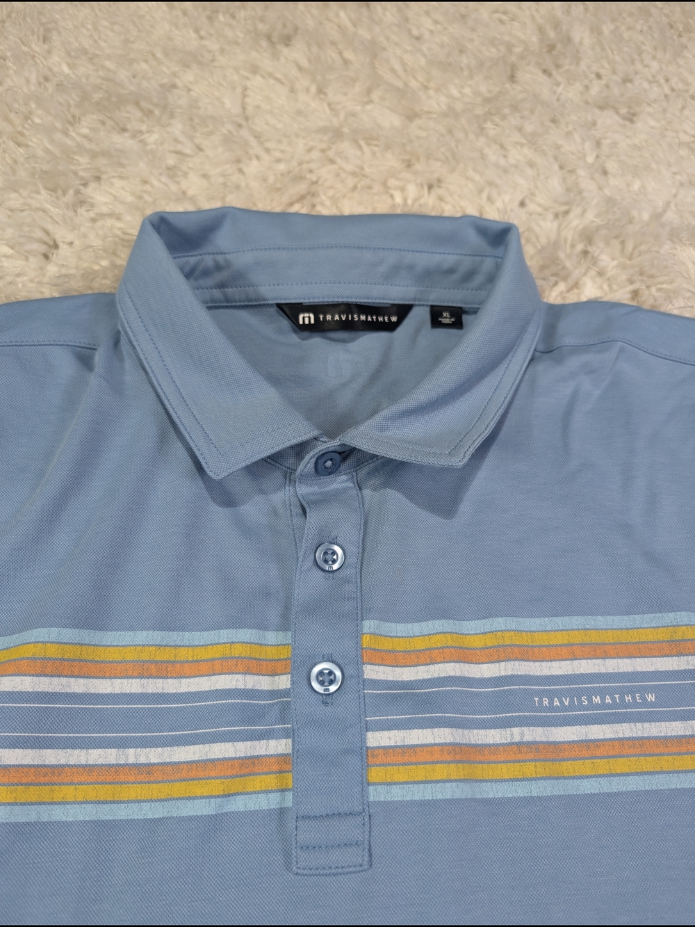 Travis Mathew Light Blue Polo with Multicolor Stripe Detail